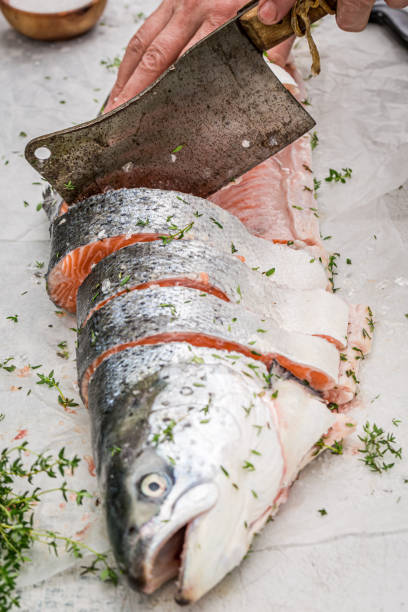 istock Chopping fresh atlantic salmon in green garden 1299638340