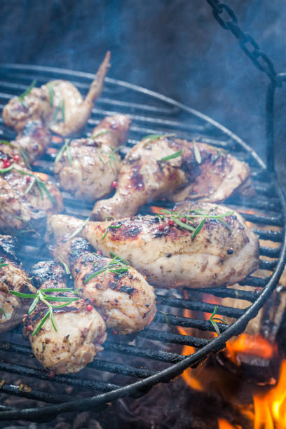 istock Hot chicken with spices on grill with fire 1299638751