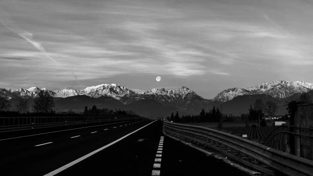 full moon over the alps - light effect full moon mountain peak european alps imagens e fotografias de stock