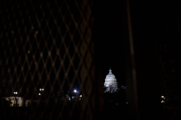 istock Fence around the U.S. Capitol Building 1299643845