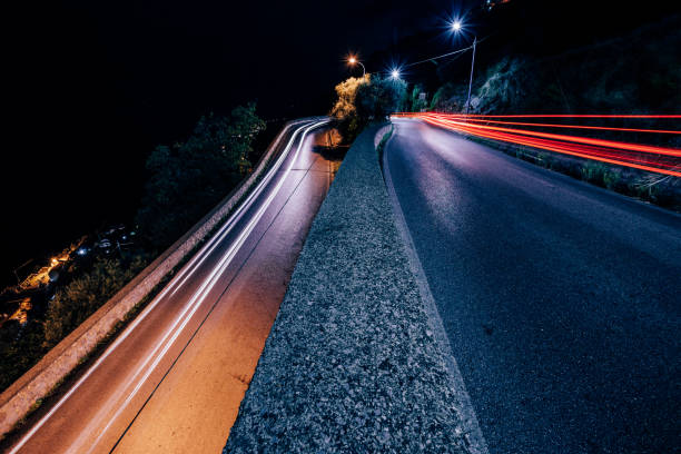 istock Light trails on a u-turn stock photo 1299645165