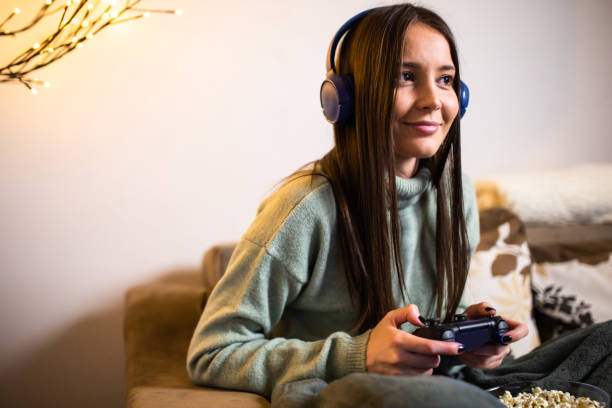 istock A young woman playing video games on a gaming console 1299650012