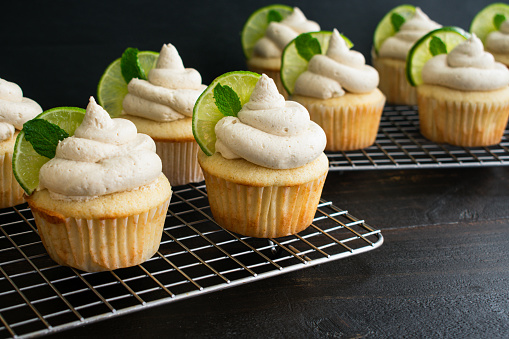 Freshly baked cupcakes topped with ginger beer and lime frosting