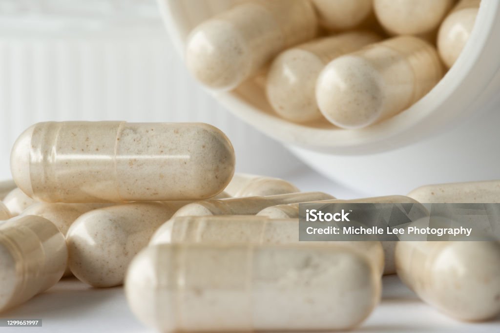 Probiotic Capsule Spilled from a Bottle Probiotic Stock Photo