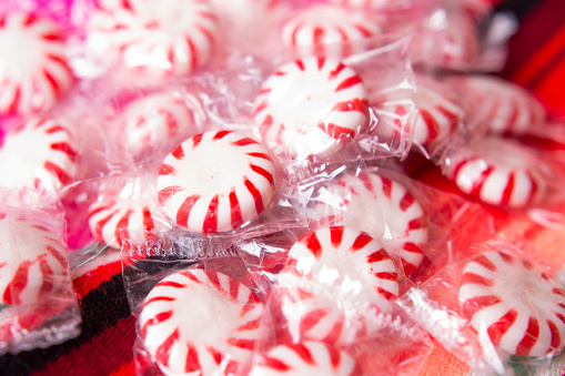 Valentine's Day Concept - Red and White Candy in wrapper.\nCandy on red background with plenty of room for your copy text.\nSee our similar candy images without the wrappers.