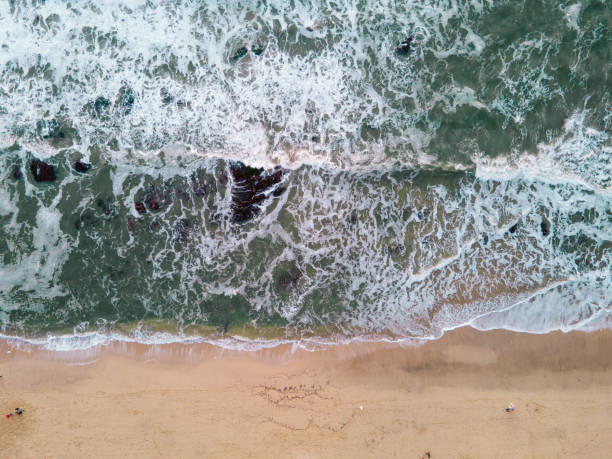 istock Aerial View of Ocean Waves Crashing 1299655070