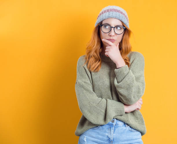 istock Suspect concept. Distrustful young woman, isolated on white background 1299655187