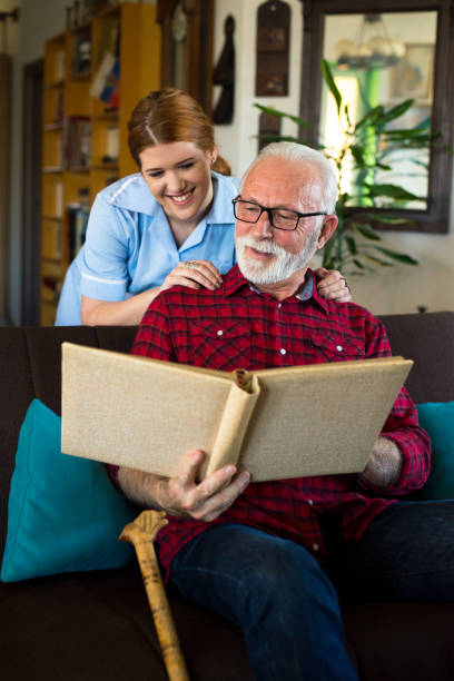 istock Senior man bonding with nurse 1299655518