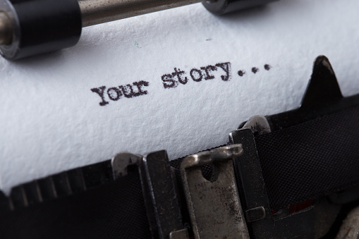 your story The text is typed on paper with an old typewriter, a vintage inscription, a story of life.