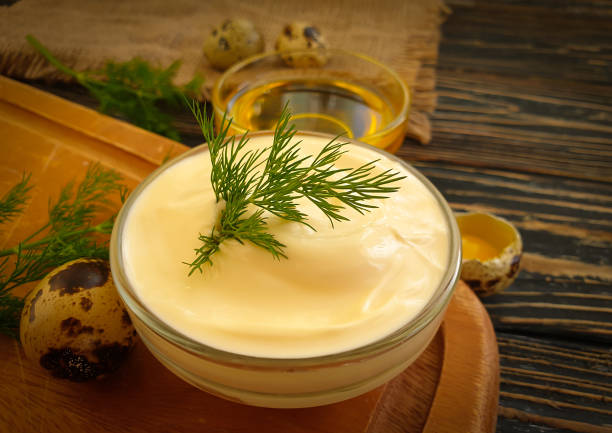 istock homemade mayonnaise, quail eggs on wooden background 1299656247