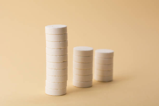 istock A stack of pills on a beige background. Growth graph made of stacked white pills - growing market and increasing demand for white pill and it's substitutes. 1299656713