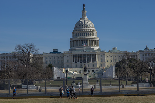Washington D.C., January 30, 2021:  Fences were erected around Capitol after January 6 when pro-Trump protesters rallied in DC ahead of Electoral College vote count and some stormed into the Capitol.  Visitors have to stay outside the fence to view the Capitol.