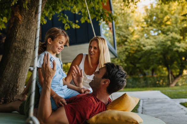 istock Parents and son playing in the back yard 1299664645