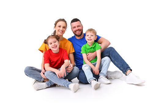 Portrait of happy parents carrying their children over white background