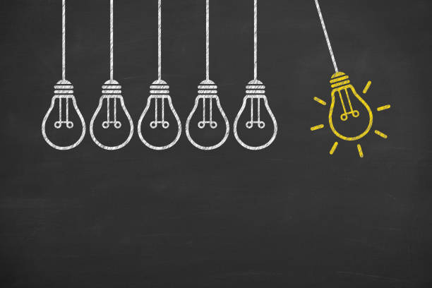 istock New idea concepts with light bulbs on a chalkboard background 1299671153