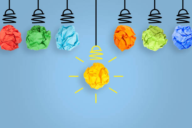 istock Creative Idea Concepts Light Bulb Crumpled Blue Paper on White Background 1299671549