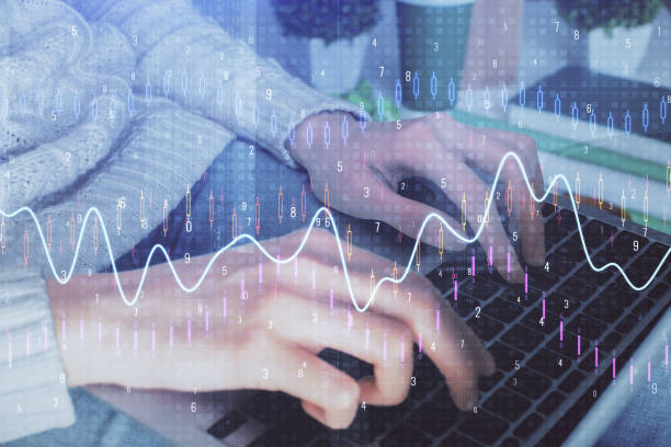 istock Double exposure of woman hands typing on computer and forex chart hologram drawing. Stock market invest concept. 1299672565