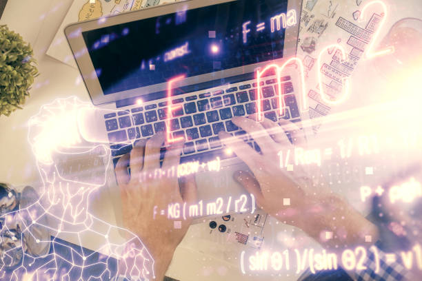 istock Double exposure of man's hands typing over computer keyboard and formula hologram drawing. Top view. Education concept. 1299672612