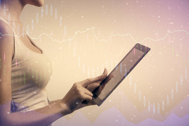 istock Double exposure of forex chart sketch hologram and woman holding and using a mobile device. Financial market concept. 1299672630