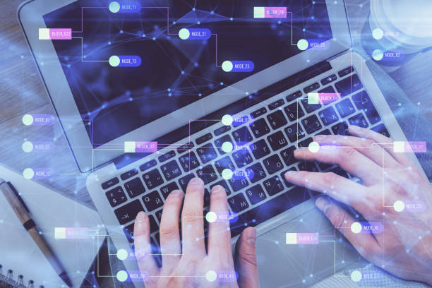 istock Multi exposure of man's hands typing over computer keyboard and data theme hologram drawing. Top view. Technology concept. 1299672632