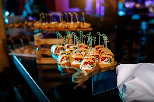 Catering services background with snacks on guests table in restaurant at event party, Ñanape