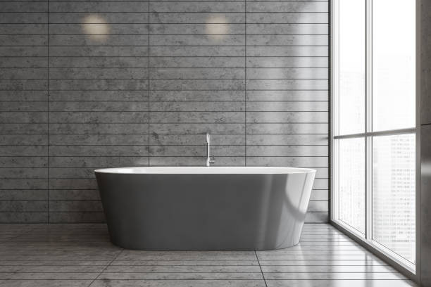 istock Gray tile bathroom interior with tub 1299674723