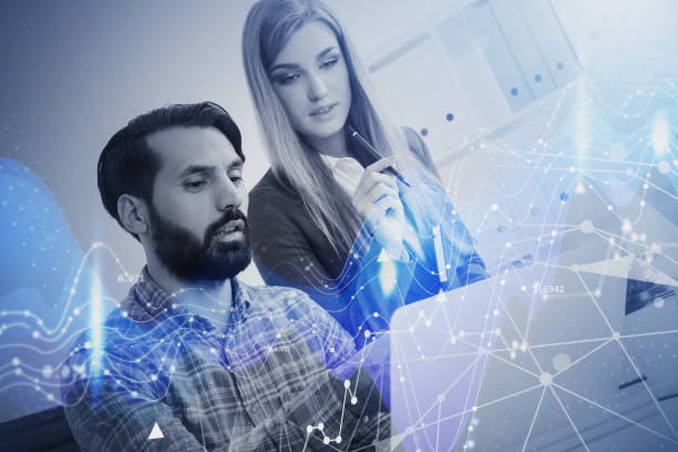 istock Man and woman in office and graph 1299675499