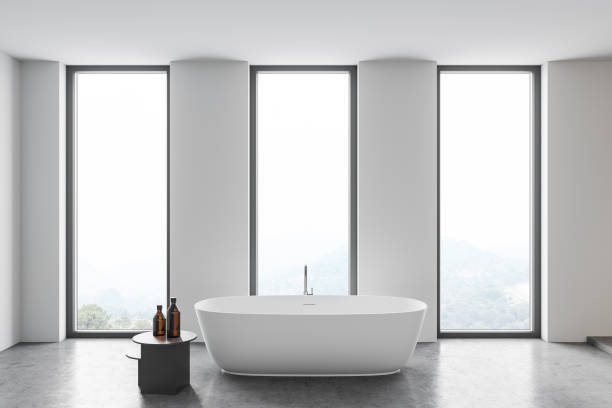 istock Modern white bathroom interior with tub 1299675674