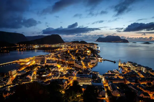 Top view of the Norwegian city of Alesund, night lighting, sunset time.