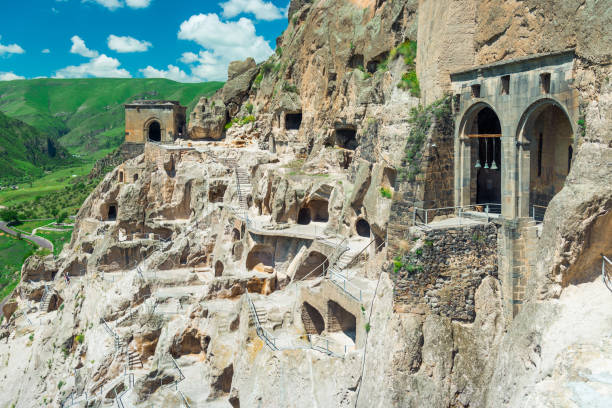 the multi-tiered cave city of vardzia, carved into the rock - a famous attraction of georgia - mosteiro imagens e fotografias de stock