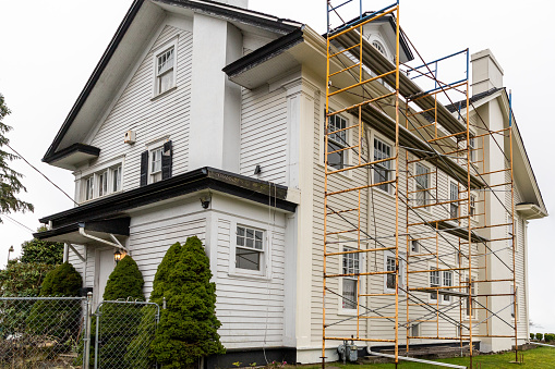 Everett, WA. USA - 01-29-2021: Scaffolding on the Side of a Home Having Repairs