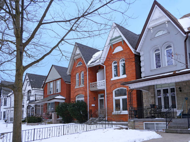 Residential street with older semidetached houses with gables Residential street with older semidetached houses with gables philadelphia winter stock pictures, royalty-free photos & images