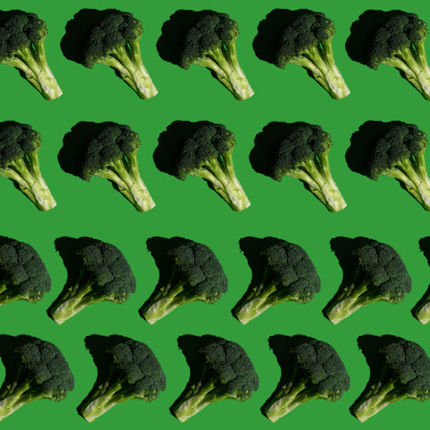 istock Broccoli pattern on a solid green background. Healthy diet. Colorful and fresh food. 1299687403