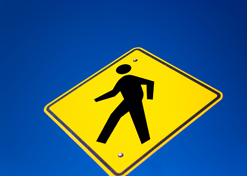 Yellow Pedestrian Crossing Sign, Vibrant Blue Sky