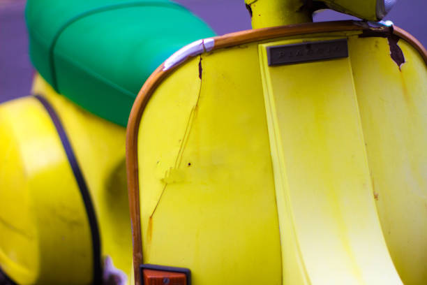 Close-up of an old rusty steering wheel of a two-wheeled motorcycle with a broken speedometer