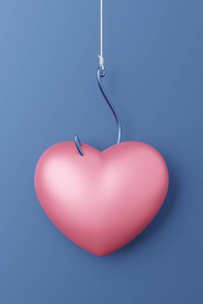 istock Hanging Heart symbol 3D rendering pink color with fishhook, Valentine's Day fall in love concept design on blue background with copy space 1299692003