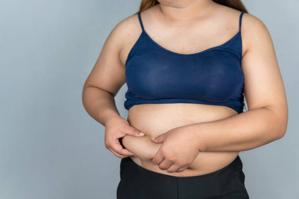 istock Fat woman measuring isolated over 1299696309