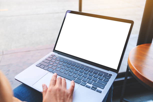 istock a woman using and touching on laptop touchpad with blank white desktop screen 1299699043