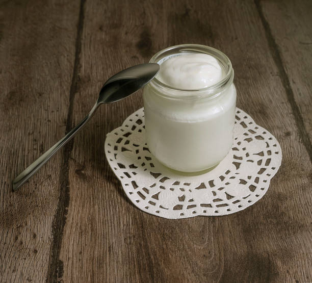 istock Homemade yoghurt in a glass jar 1299705773