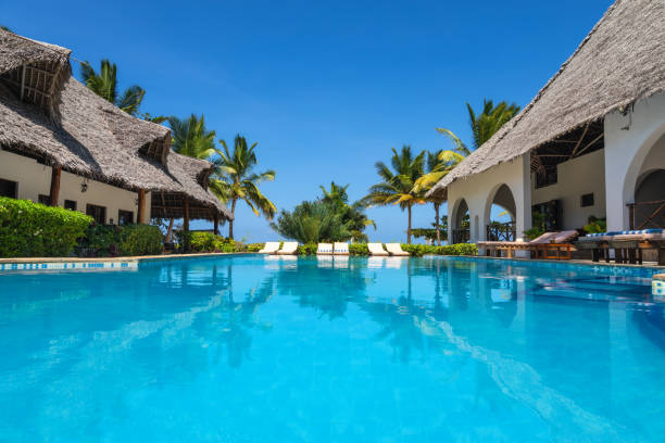 Luxury Appartments With Pool Swimming pool in luxury holiday resort (Zanzibar, Tanzania). Property released. holiday camp stock pictures, royalty-free photos & images