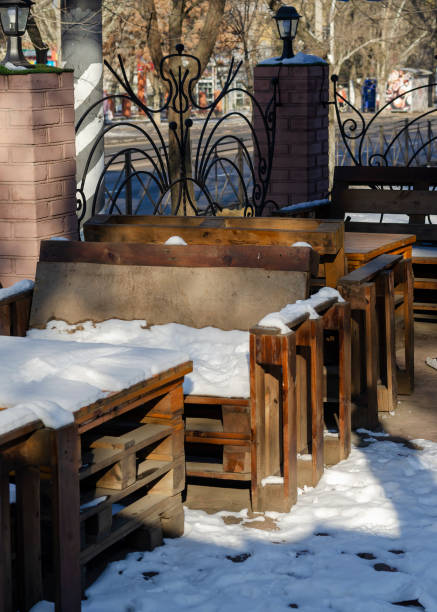 istock An empty street cafe covered with snow. 1299711710