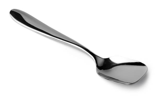 istock Silver spoon isolated on white background close up 1299712988