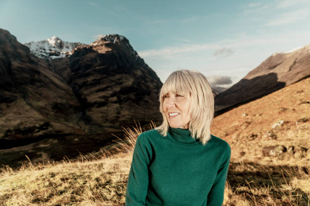 istock Woman relaxing in Glencoe Scotland 1299714870