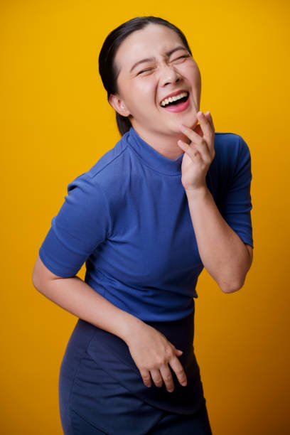 istock Happy woman showing toothy smile. 1299715076