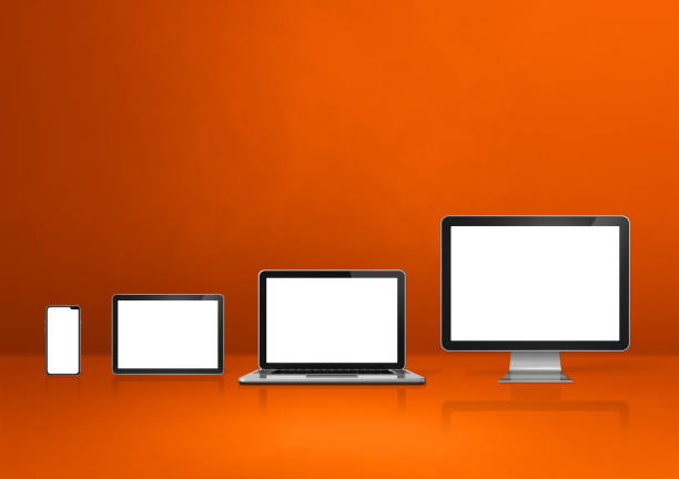 istock computer, laptop, mobile phone and digital tablet pc. orange background 1299716055