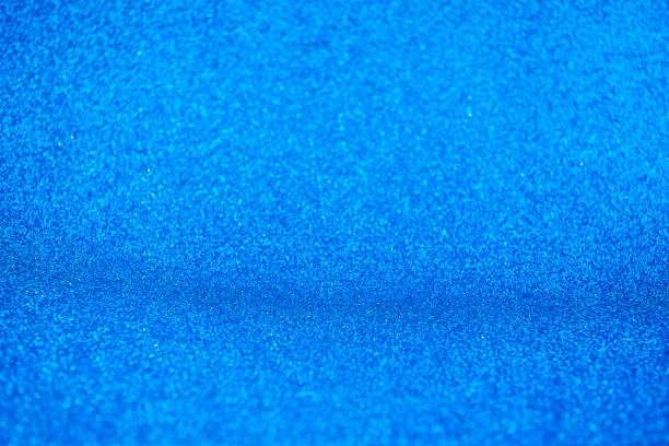 istock Abstract dark vivid navy blue sparkling glitter wall and floor perspective background studio with blur bokeh.luxury holiday backdrop mock up for display of product.holiday festive greeting card 1299716078