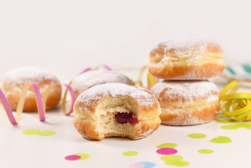 Berliner Pfannkuchen, a traditional German donut like dessert made from sweet yeast dough fried in fat with jam filling. Traditional served during carnival.