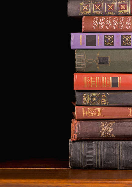istock Old hardcover books against a dark background 1299718276