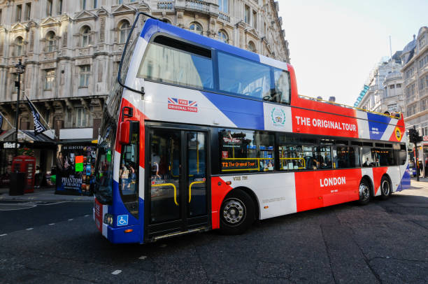Side view of an empty red Route Master bus in London