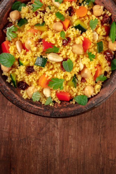 istock Couscous close-up in a tagine, top shot with copy space 1299720718